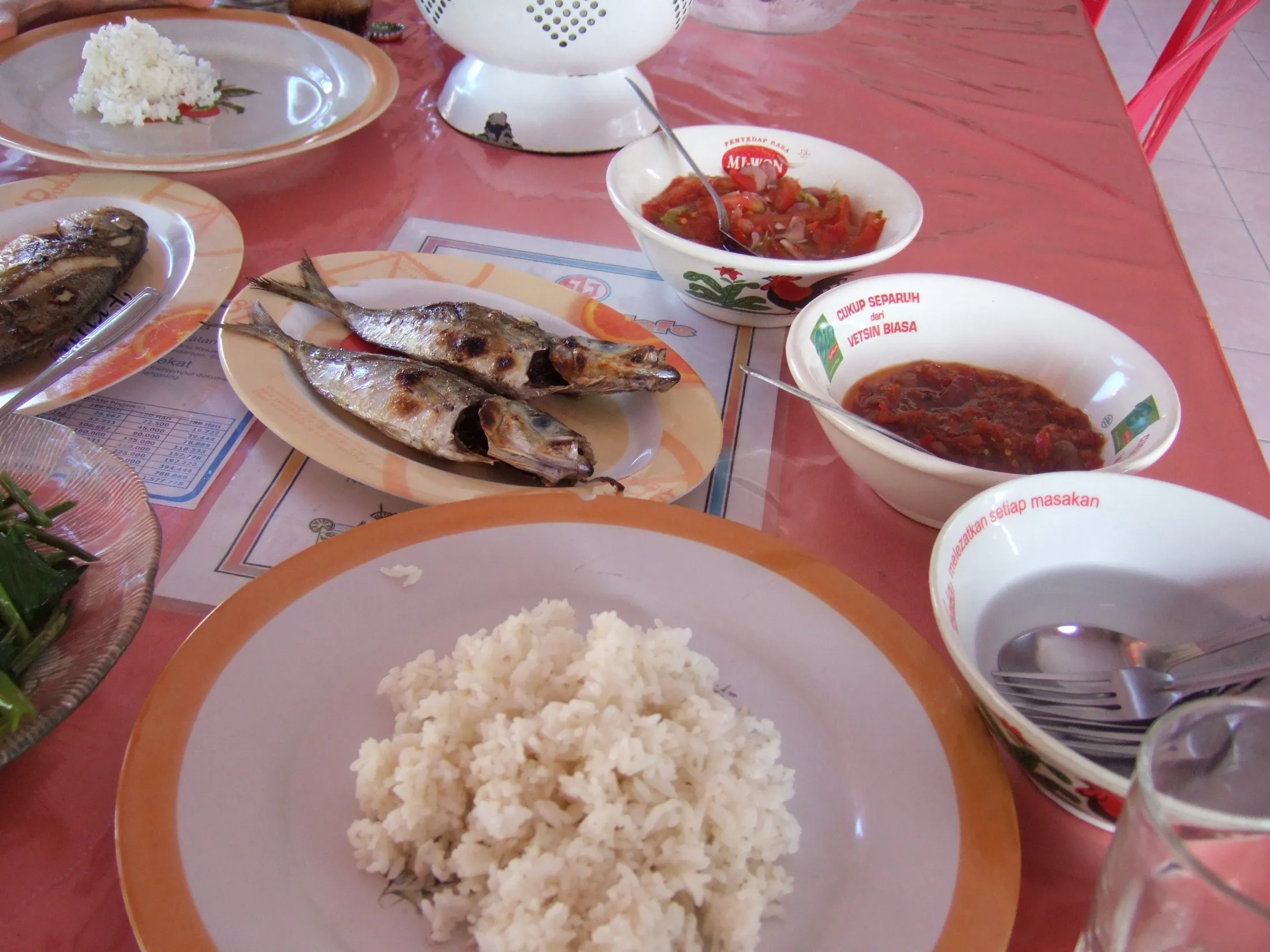 Grilled fish with rice and sambals, photographed in Bitung.